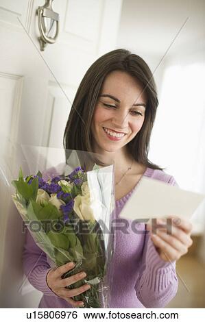Young happy woman receiving flowers View Large Photo Image Stock Photograph - Young happy woman receiving flowers. Fotosearch