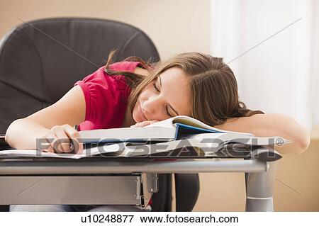 Stock Photo - Young woman sleeping on books. Fotosearch