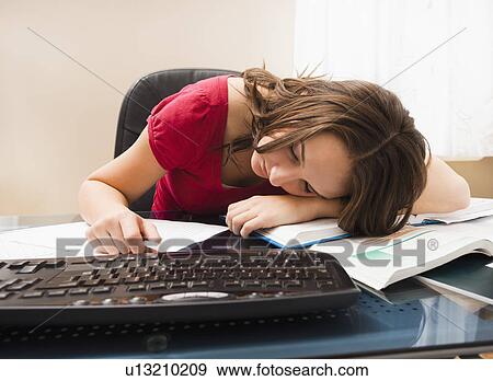 Stock Photo - Young woman studying. Fotosearch