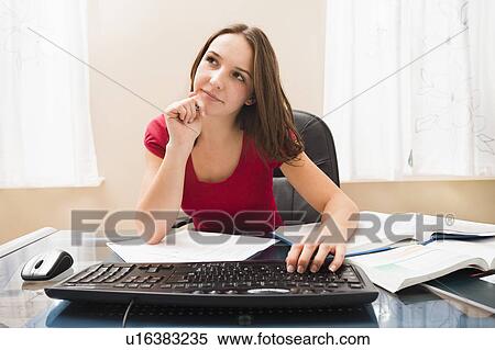 Stock Photography - Young woman studying. Fotosearch