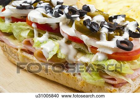 A Sandwich With Meat, Vegetables And Olives View Large Photo Image Stock Image - A Sandwich With Meat, Vegetables And Olives. Fotosearch