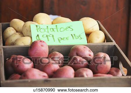 Stock Image - red and white potatoes in a crate for sale; troutdale, oregon, united states of america. Fotosearch