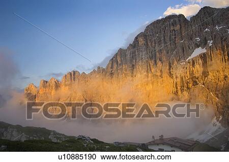 Stock Image - sunset on the dolomites and mount civetta; veneto, italy. Fotosearch