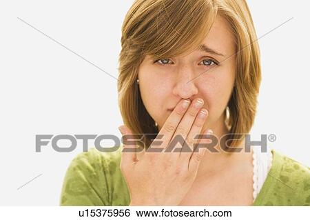 Stock Photograph - woman looking embarrassed. Fotosearch