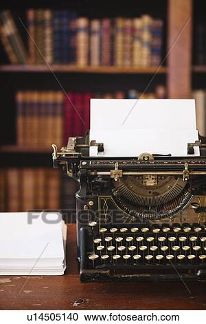 Stock Image - Antique typewriter in library. Fotosearch