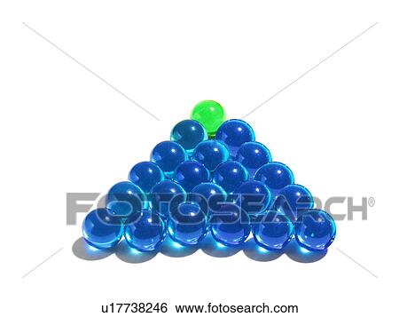 Stock Photograph - Blue glass balls and green one on the top. Fotosearch