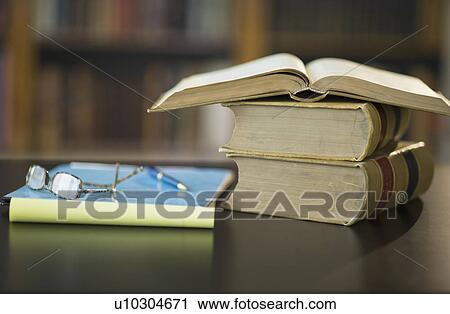 Books on desk in library View Large Photo Image Stock Image - Books on desk in library. Fotosearch