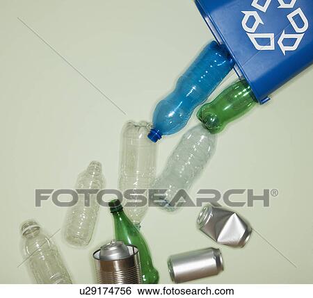 Stock Photograph - Bottles and cans falling from recycle container. Fotosearch
