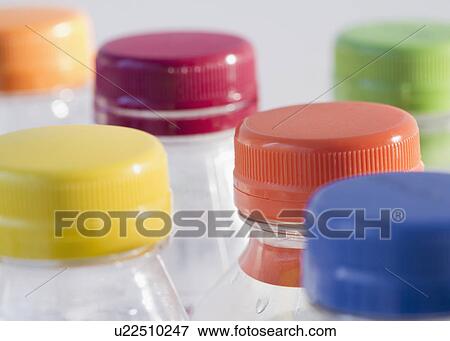 Bottles with colorful caps View Large Photo Image Stock Photo - Bottles with colorful caps. Fotosearch