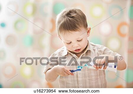 Picture - Boy (2-3) brushing teeth. Fotosearch