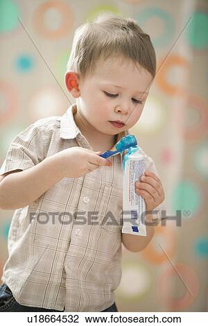 Stock Image - Boy (2-3) brushing teeth. Fotosearch