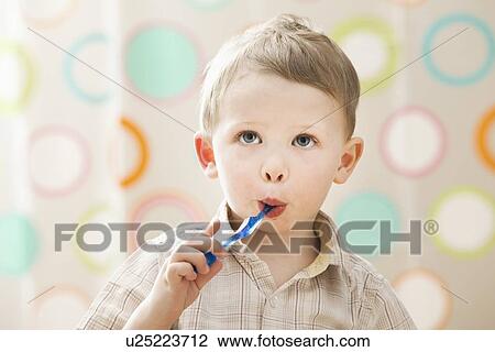 Stock Image - Boy (2-3) brushing teeth. Fotosearch