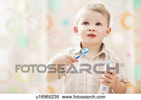 Stock Photography - Boy (2-3) brushing teeth. Fotosearch