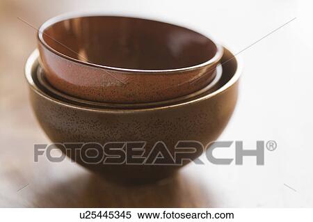 Brown bowls stacked together View Large Photo Image Stock Photography - Brown bowls stacked together. Fotosearch