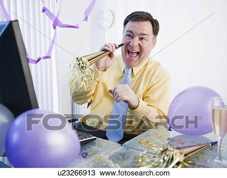 Businessman at office party View Large Photo Image Stock Image - Businessman at office party. Fotosearch