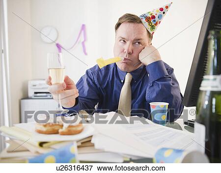 Businessman at office party View Large Photo Image Stock Photo - Businessman at office party. Fotosearch