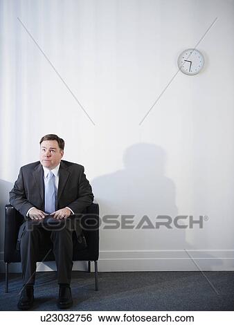 Businessman in waiting room View Large Photo Image Stock Photograph - Businessman in waiting room. Fotosearch