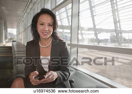 Businesswoman reading documents View Large Photo Image Stock Photograph - Businesswoman reading documents. Fotosearch