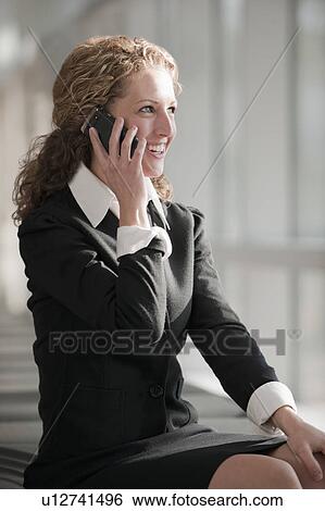 Stock Photograph - Businesswoman talking on phone. Fotosearch