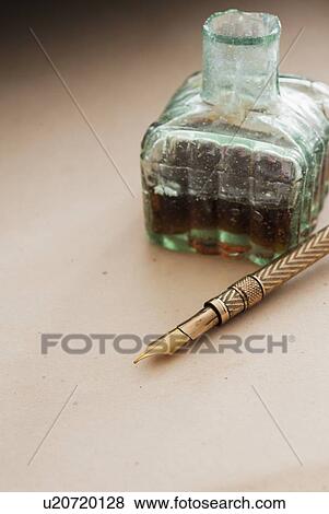 Stock Photo - Close up antique ink well and pen. Fotosearch