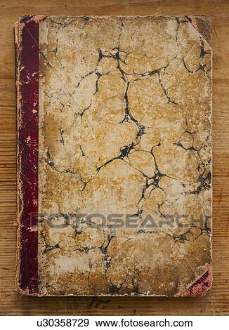 Close up of antique book cover View Large Photo Image Stock Photo - Close up of antique book cover. Fotosearch