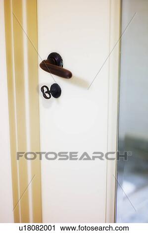 Stock Image - close-up of antique door with handle and lock. Fotosearch