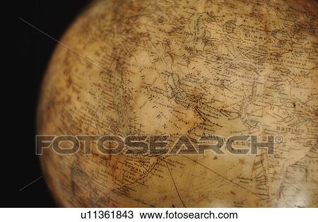 Stock Image - Close up of antique globe. Fotosearch
