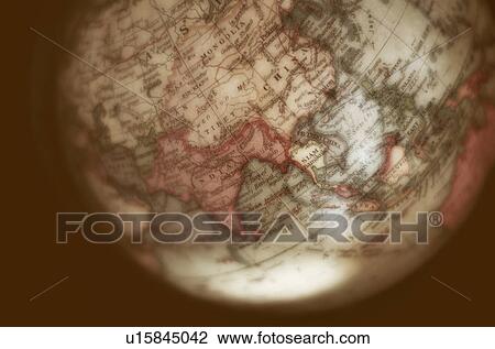 Stock Image - Close up of antique globe. Fotosearch