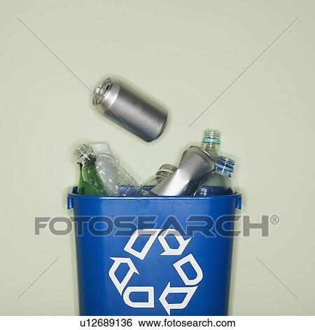 Stock Photograph - Close up of bottles and cans in recycle container. Fotosearch