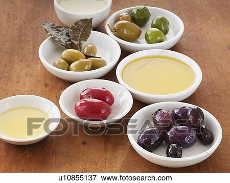 Close up of bowls with olives and sauces View Large Photo Image Stock Photo - Close up of bowls with olives and sauces. Fotosearch