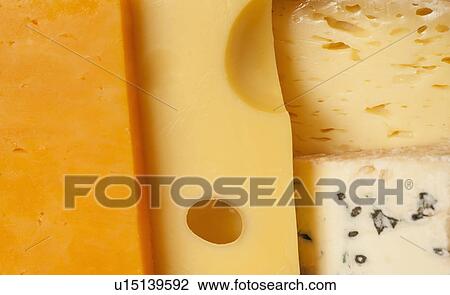Close-up of cheese slices View Large Photo Image Stock Image - Close-up of cheese slices. Fotosearch