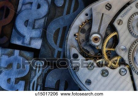 Stock Photograph - Close up of clock mechanism and dollar sign. Fotosearch