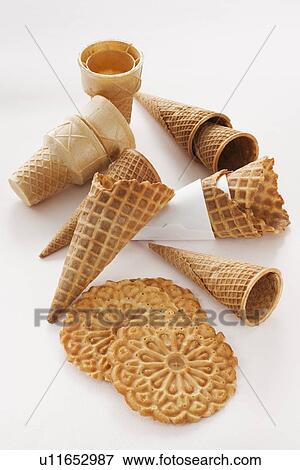 Stock Photo - Close up of empty ice cream cones and wafers. Fotosearch