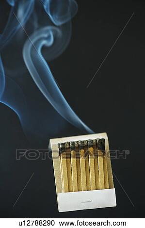 Stock Image - Close up of extinguished matches with smoke. Fotosearch