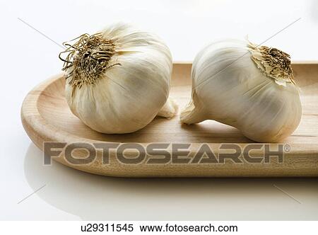 Close up of garlic on wooden tray View Large Photo Image Stock Photography - Close up of garlic on wooden tray. Fotosearch