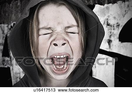 Stock Image - Close-up of girl (6-7) screaming. Fotosearch