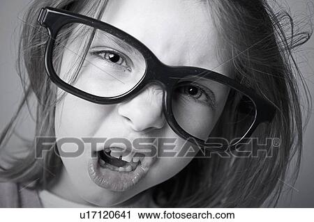 Stock Image - Close-up of girl (6-7) shouting. Fotosearch