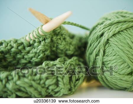 Close-up of green knitwear and yarn View Large Photo Image Stock Photo - Close-up of green knitwear and yarn. Fotosearch