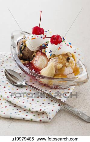 Stock Photography - Close up of ice cream dessert with colorful topping. Fotosearch