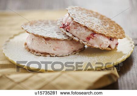 Stock Image - Close up of ice cream sandwiches. Fotosearch
