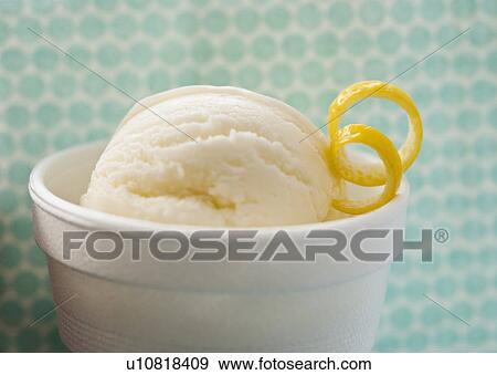Stock Photo - Close up of ice cream with lemon peel. Fotosearch