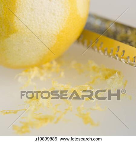 Close-up of lemon and grater View Large Photo Image Stock Photograph - Close-up of lemon and grater. Fotosearch