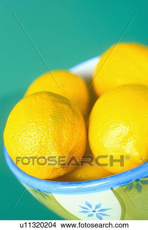 Close-up of lemons in bowl View Large Photo Image Picture - Close-up of lemons in bowl. Fotosearch