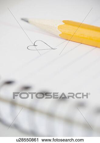 Close-up of pencil and notebook with heart drawing View Large Photo Image Stock Image - Close-up of pencil and notebook with heart drawing. Fotosearch