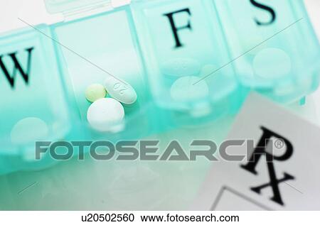 Stock Image - Close up of pill container. Fotosearch