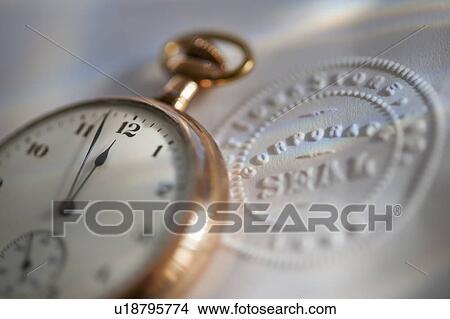 Close up of pocket watch and corporate seal View Large Photo Image Picture - Close up of pocket watch and corporate seal. Fotosearch