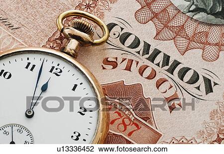 Close up of pocket watch on stock share View Large Photo Image Stock Image - Close up of pocket watch on stock share. Fotosearch