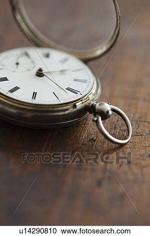 Stock Image - Close up of pocket watch. Fotosearch