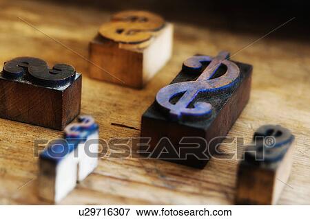 Close up of printing blocks with dollar sign on wood View Large Photo Image Stock Photo - Close up of printing blocks with dollar sign on wood. Fotosearch