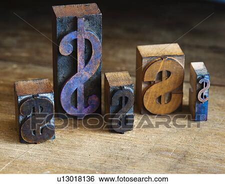 Close up of printing blocks with dollar sign on wood View Large Photo Image Stock Photograph - Close up of printing blocks with dollar sign on wood. Fotosearch